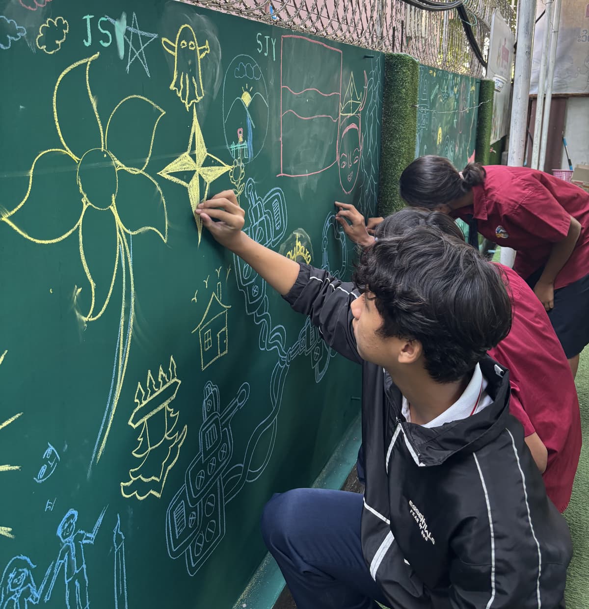 Students painting mural art together